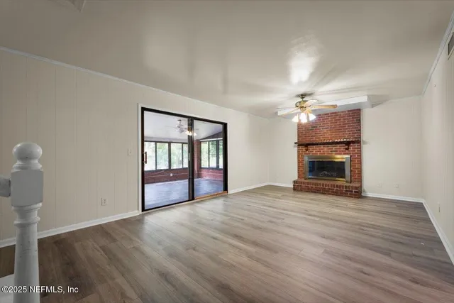a bathroom with a granite countertop toilet sink and mirror