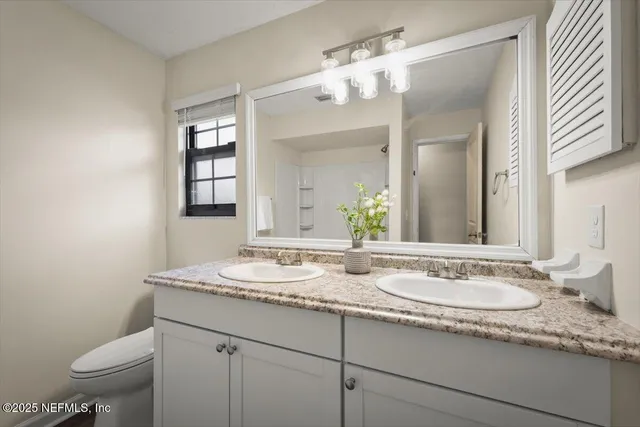 a view of room with window and ceiling fan