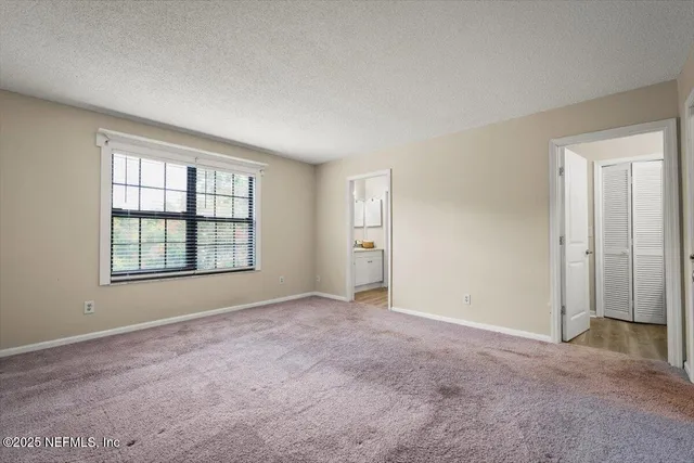 a view of a house with backyard and porch