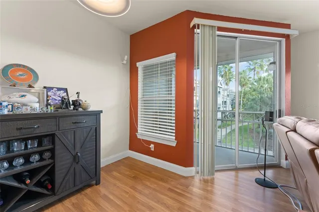 a view of a livingroom with furniture and a window