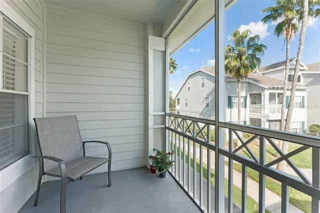 a view of a chair and table in the balcony