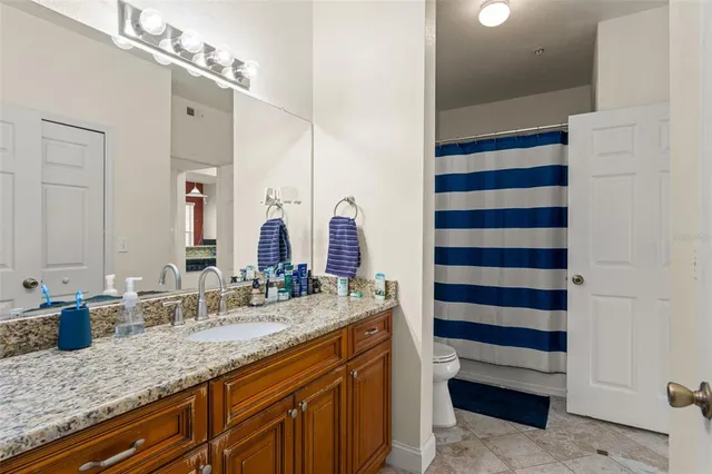 a bathroom with a sink double vanity and a mirror