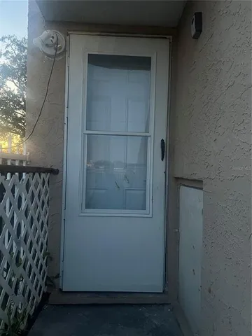 a bedroom with a bed and a flat tv screen on the dresser