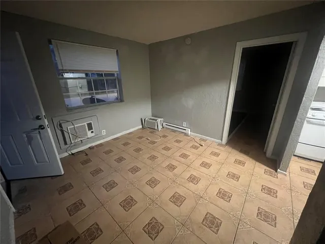 a kitchen with a cabinets and white appliances