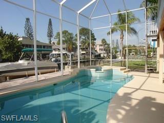 1283 Rainbow Court Naples, FL 34110 - Photo 3 of 8 a view of a swimming pool