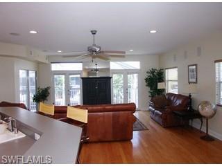 1283 Rainbow Court Naples, FL 34110 - Photo 4 of 8 a living room with furniture and a fireplace