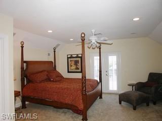 1283 Rainbow Court Naples, FL 34110 - Photo 5 of 8 a bedroom with a bed window and a couch
