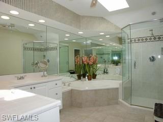 1283 Rainbow Court Naples, FL 34110 - Photo 8 of 8 a bathroom with a double vanity sink mirror and shower
