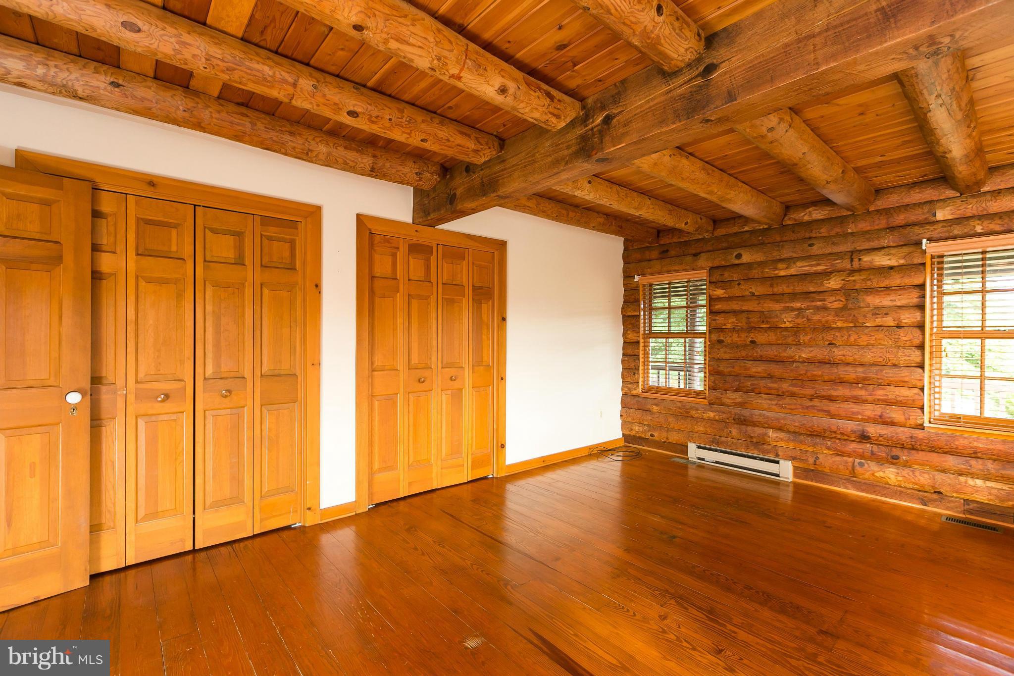 1725 Gablehammer Road Westminster, MD 21157 - Photo 13 of 30 a view of an empty room with wooden floor and a window