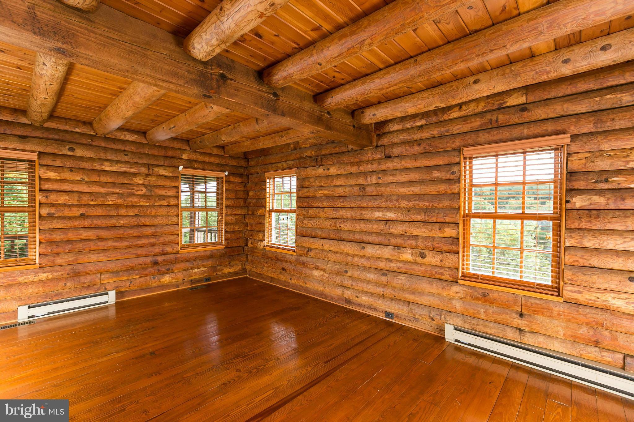 1725 Gablehammer Road Westminster, MD 21157 - Photo 14 of 30 a view of an empty room with a window and wooden floor