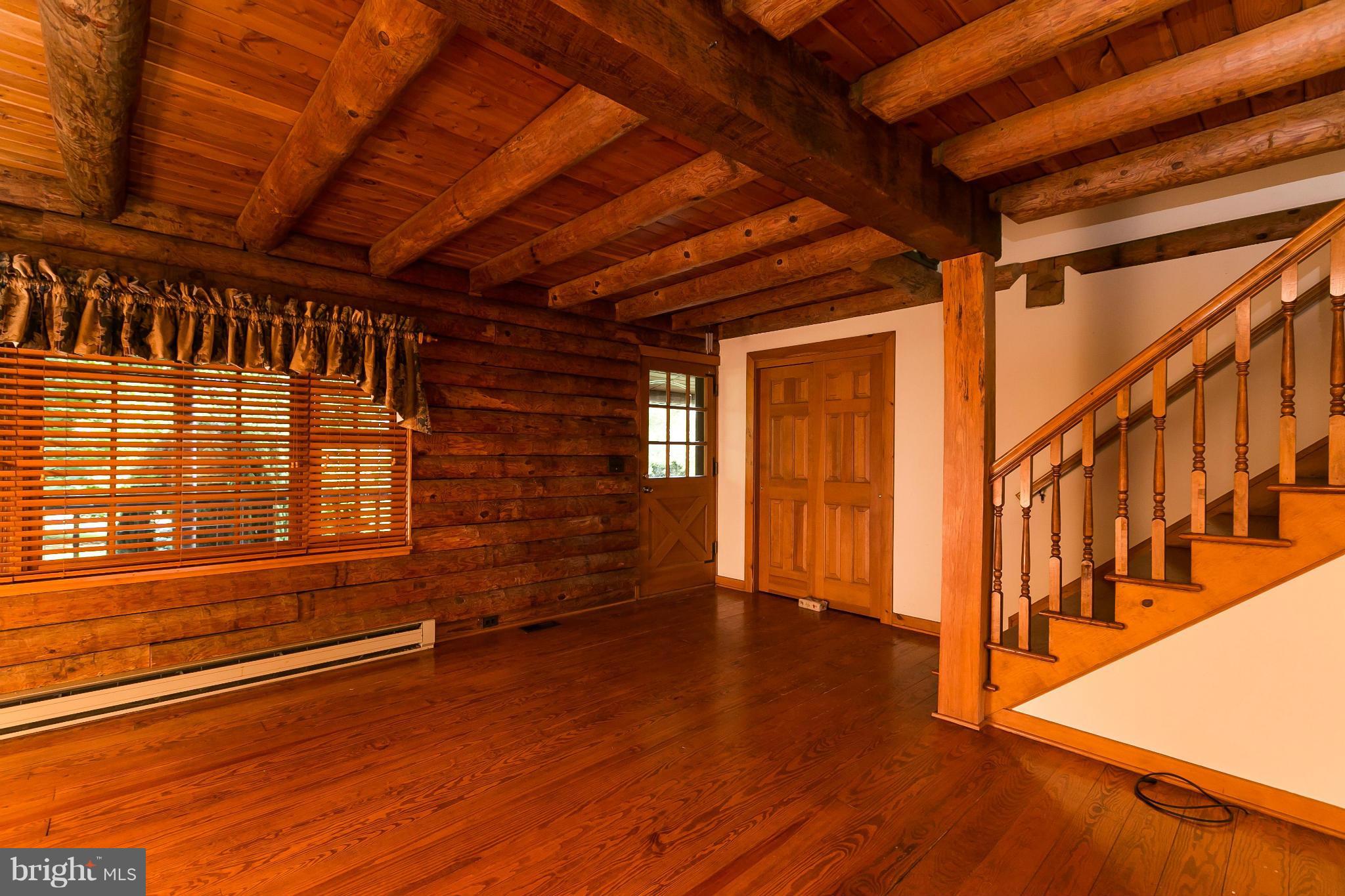 1725 Gablehammer Road Westminster, MD 21157 - Photo 6 of 30 a view of an empty room with wooden floor and a window