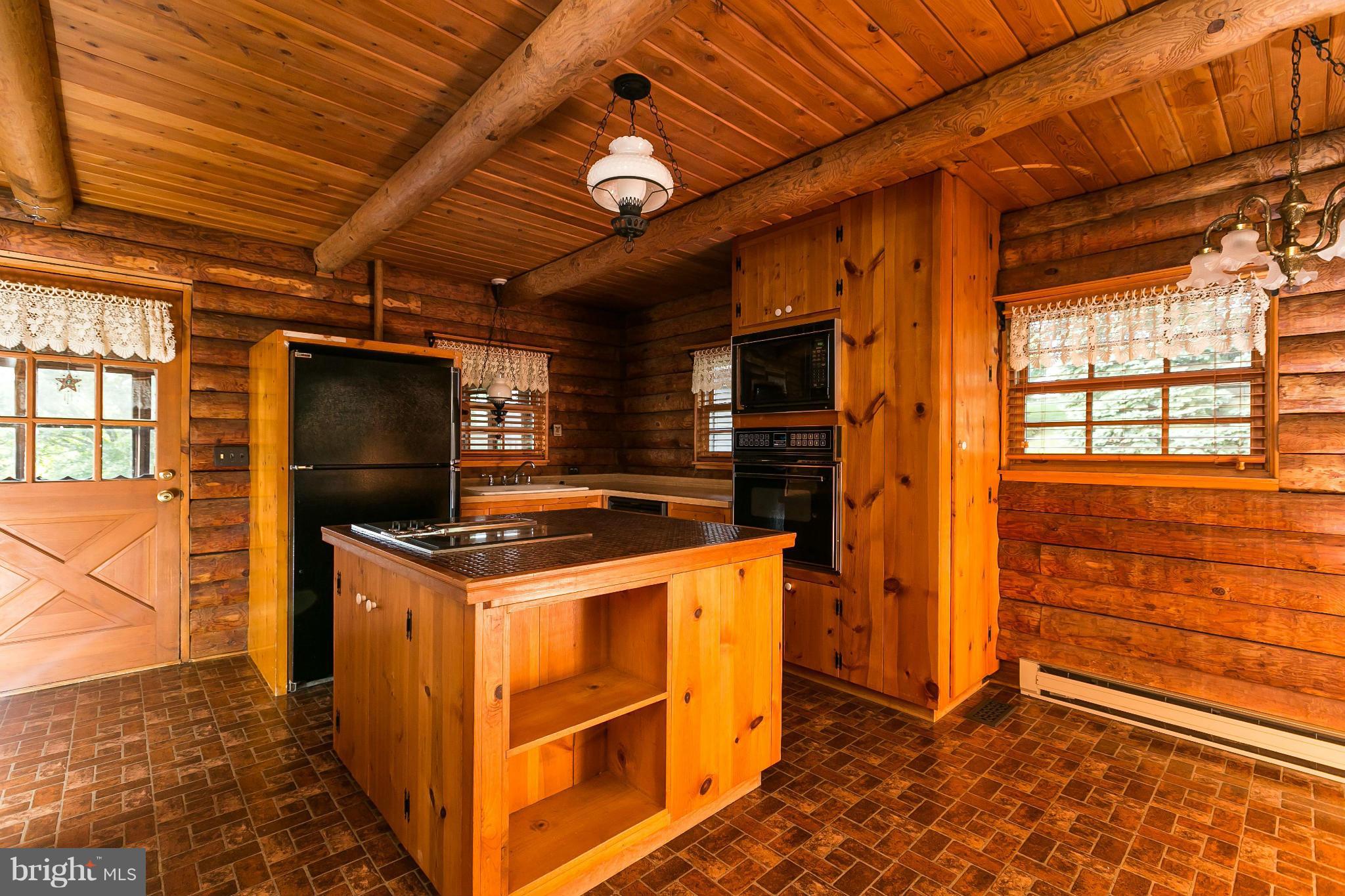 1725 Gablehammer Road Westminster, MD 21157 - Photo 10 of 30 a kitchen that has a stove and a microwave oven
