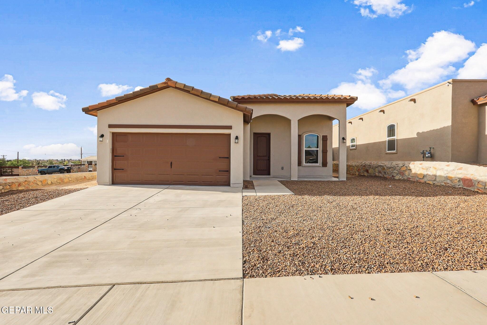 1153 Marquitos Avenue Anthony, NM 88021 - Photo 2 of 40 a view of a house with a outdoor space