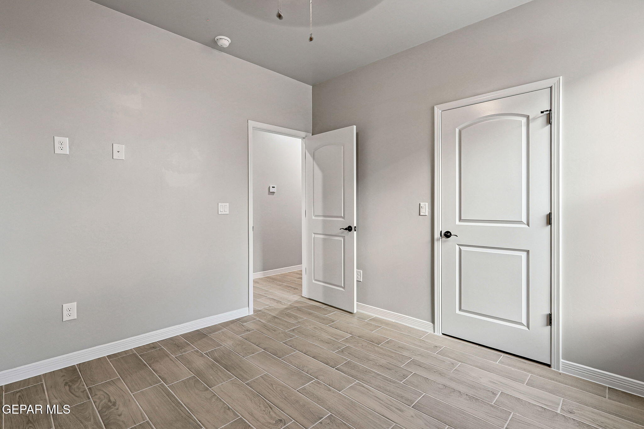 1153 Marquitos Avenue Anthony, NM 88021 - Photo 27 of 40 wooden floor in an empty room