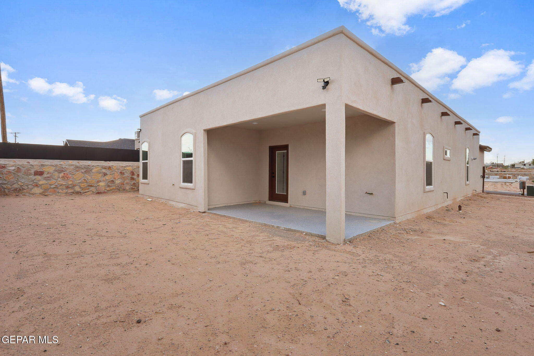 1153 Marquitos Avenue Anthony, NM 88021 - Photo 29 of 40 a view of a white house with a yard