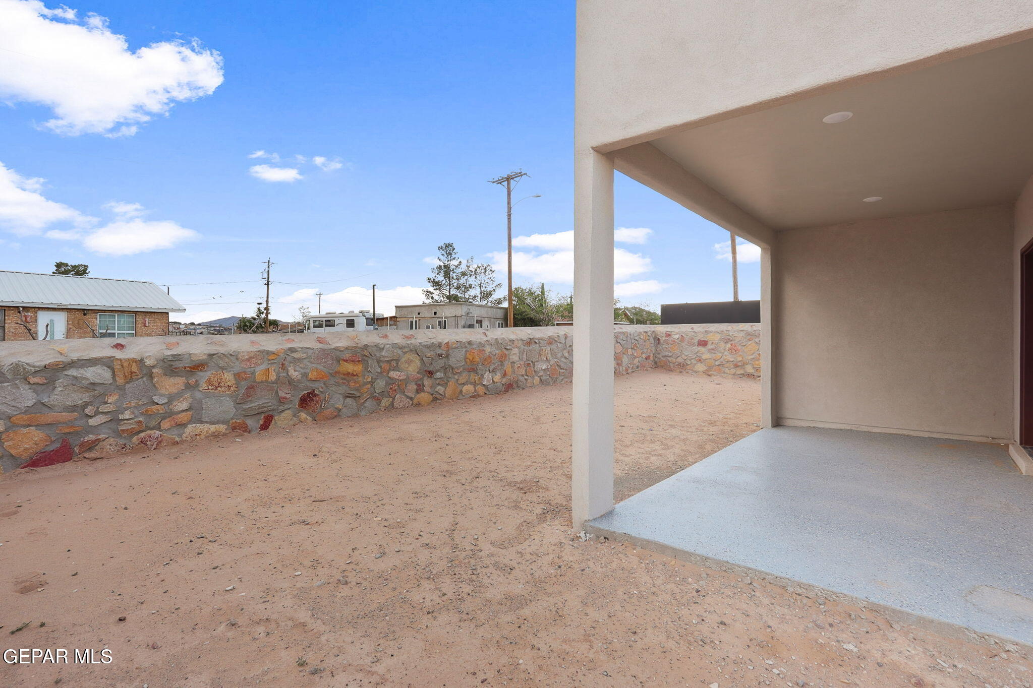 1153 Marquitos Avenue Anthony, NM 88021 - Photo 30 of 40 a view of a dry yard with wooden fence