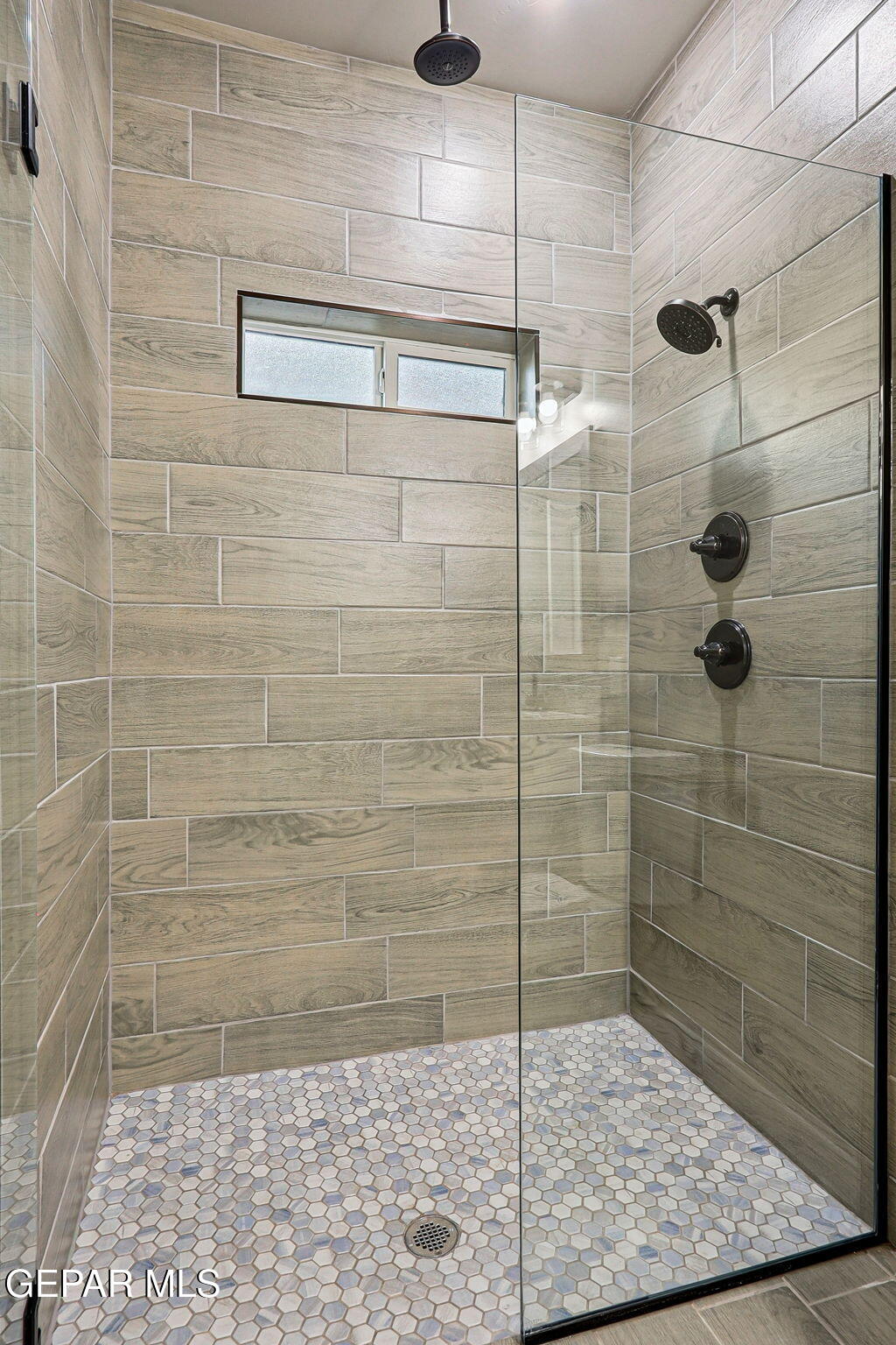 1153 Marquitos Avenue Anthony, NM 88021 - Photo 39 of 40 a bathroom with a shower