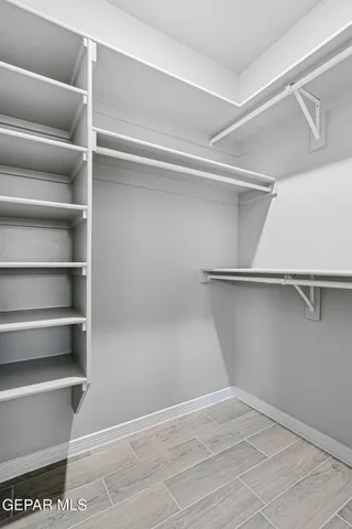 a view of an empty walk in closet