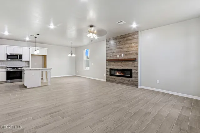 a view of a kitchen with a sink and a stove top oven