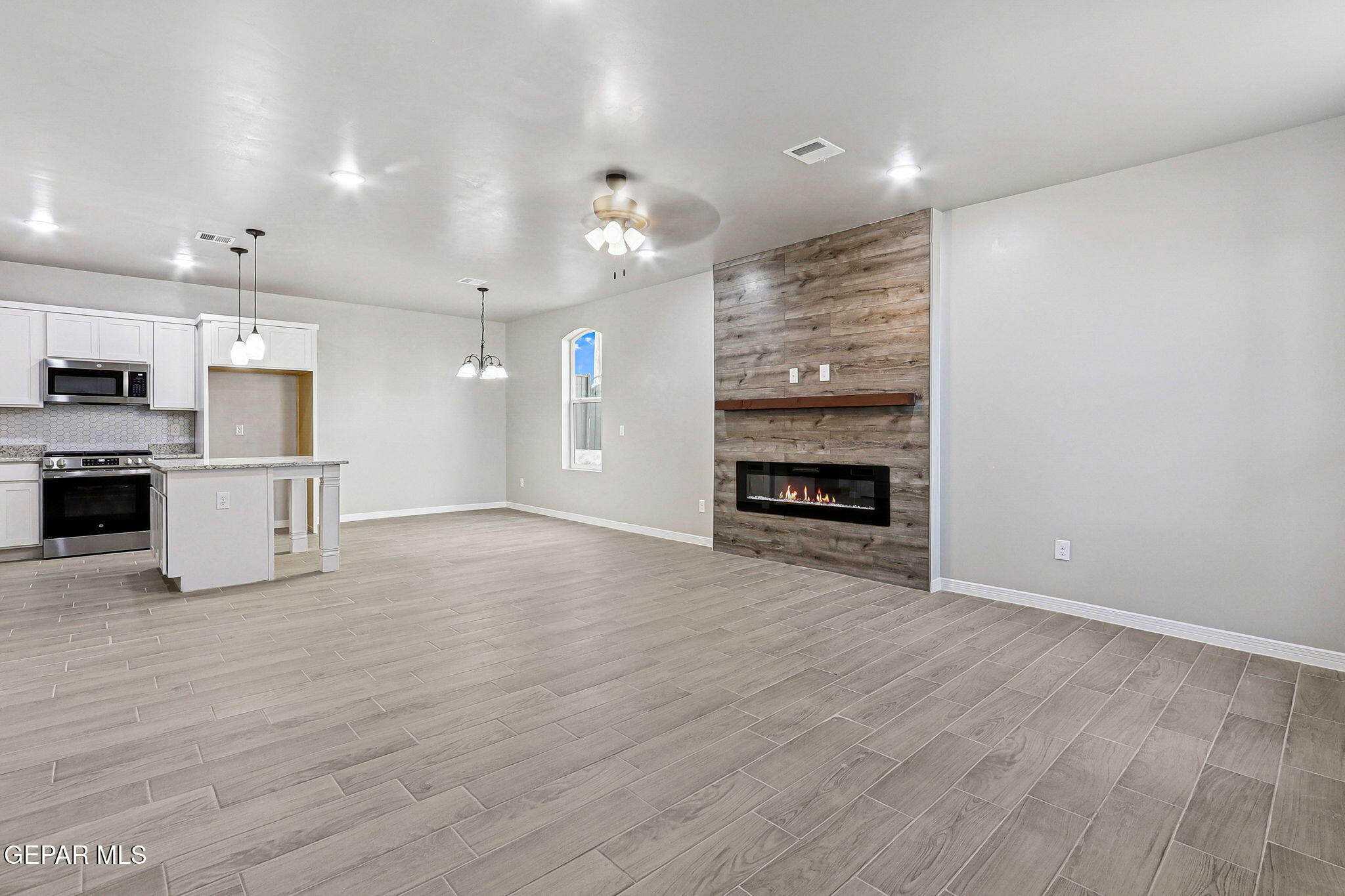 1153 Marquitos Avenue Anthony, NM 88021 - Photo 4 of 40 a view of a kitchen with a sink and a stove top oven