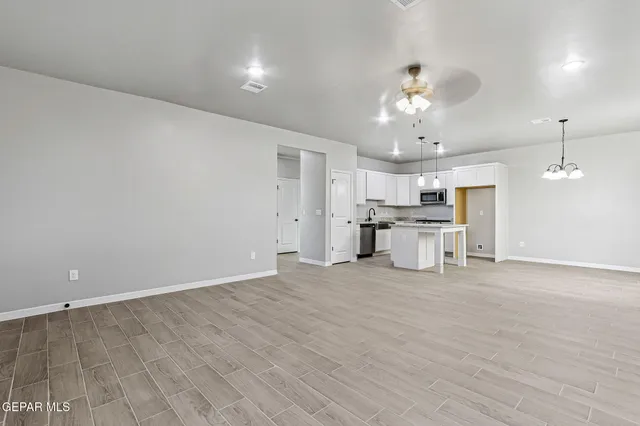 a view of a livingroom with a kitchen