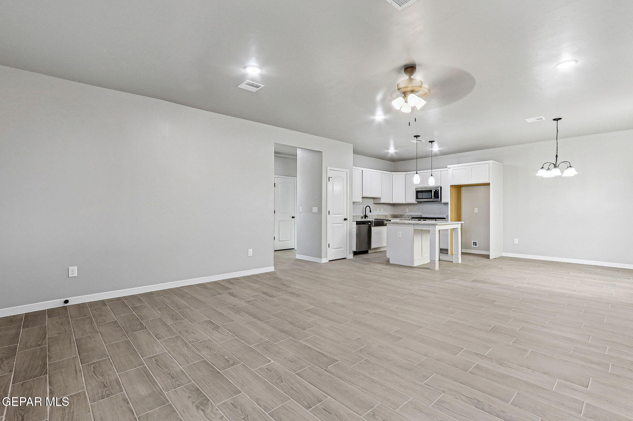 1153 Marquitos Avenue Anthony, NM 88021 - Photo 5 of 40 a view of a livingroom with a kitchen