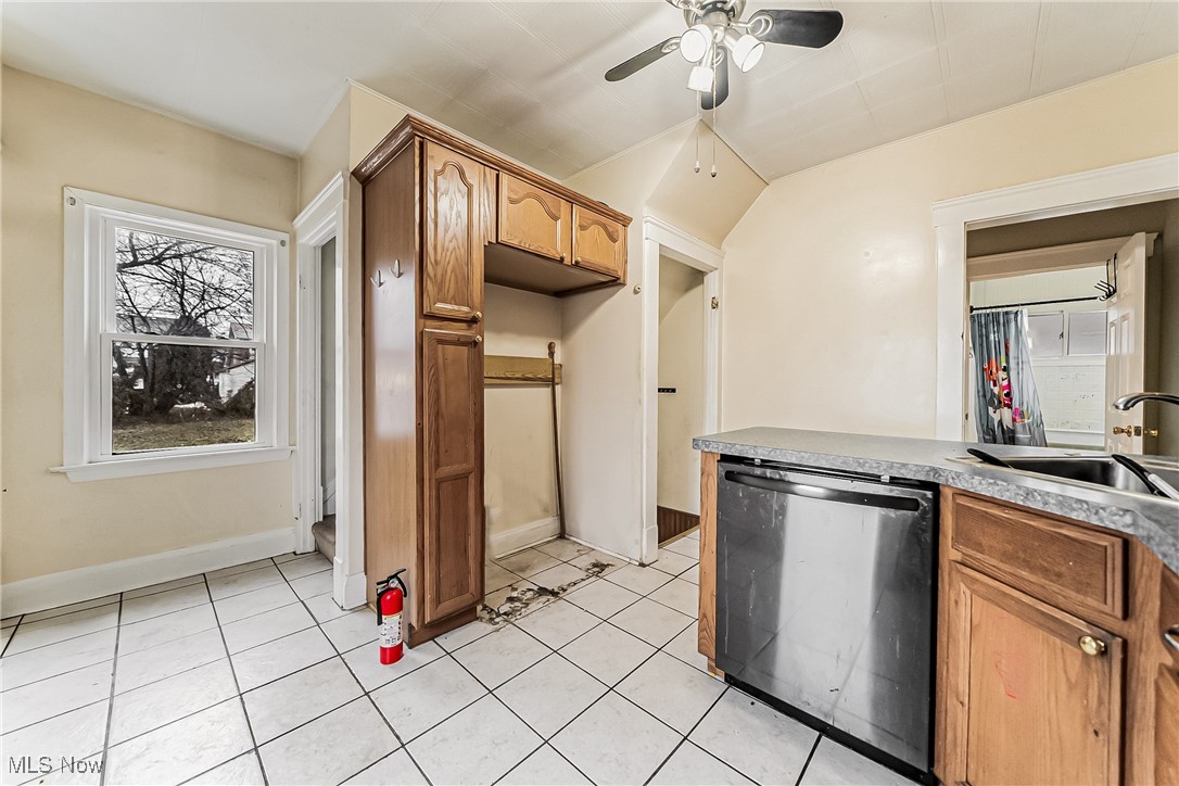 2014 Cook Avenue Cleveland, OH 44109 - Photo 11 of 37 Kitchen featuring dishwasher, sink, light tile patterned flooring, and ceiling fan
