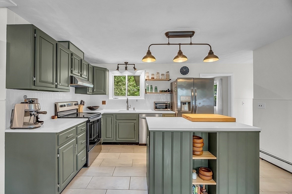 33 Wendover Road Worcester, MA 01606 - Photo 12 of 42 a kitchen with stainless steel appliances granite countertop a sink stove and cabinets