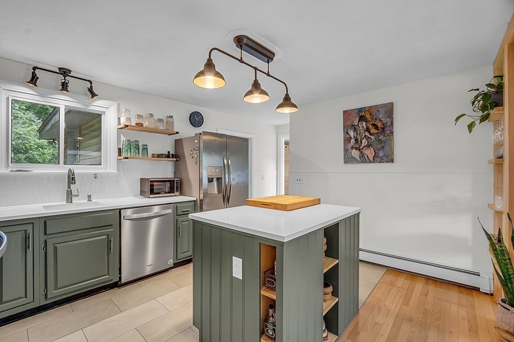 33 Wendover Road Worcester, MA 01606 - Photo 13 of 42 a kitchen with a sink a stove and wooden floor