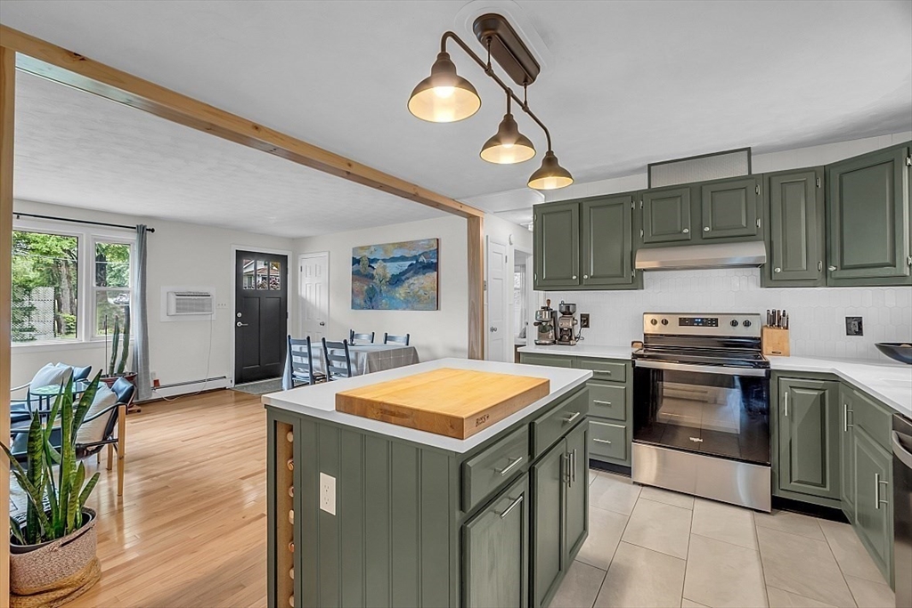 33 Wendover Road Worcester, MA 01606 - Photo 17 of 42 a kitchen with a stove a sink and a refrigerator