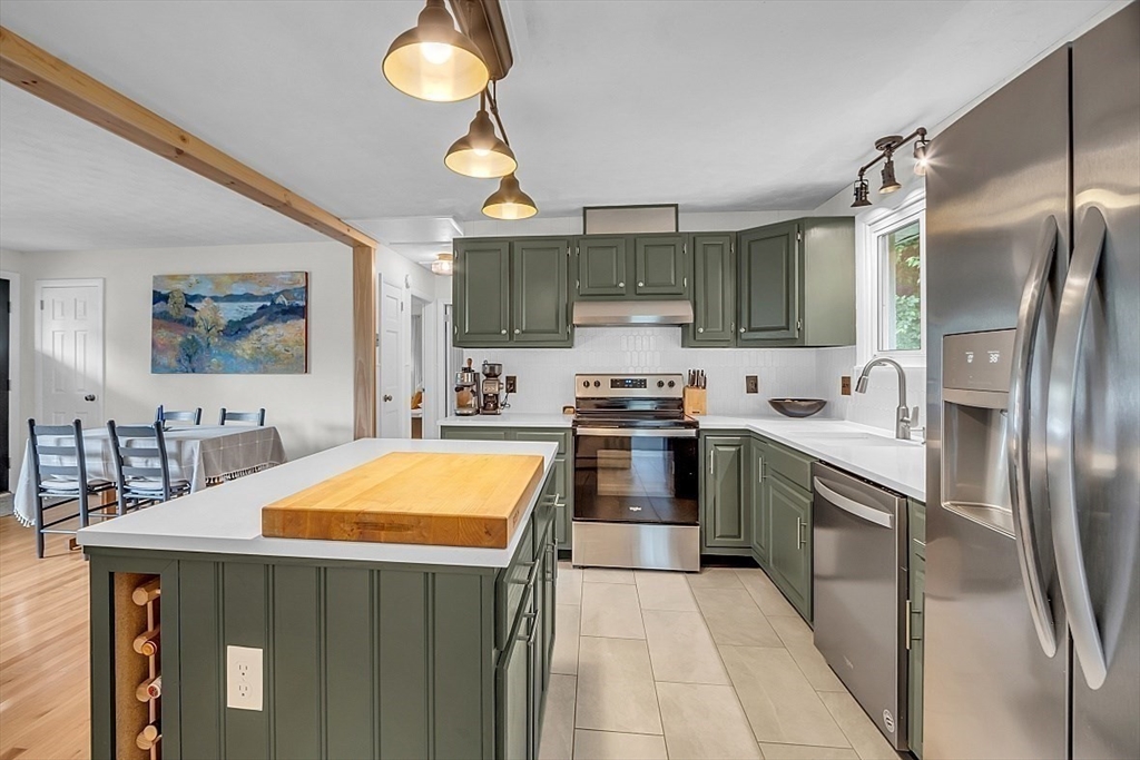 33 Wendover Road Worcester, MA 01606 - Photo 21 of 42 a kitchen with stainless steel appliances a stove a sink refrigerator and cabinets