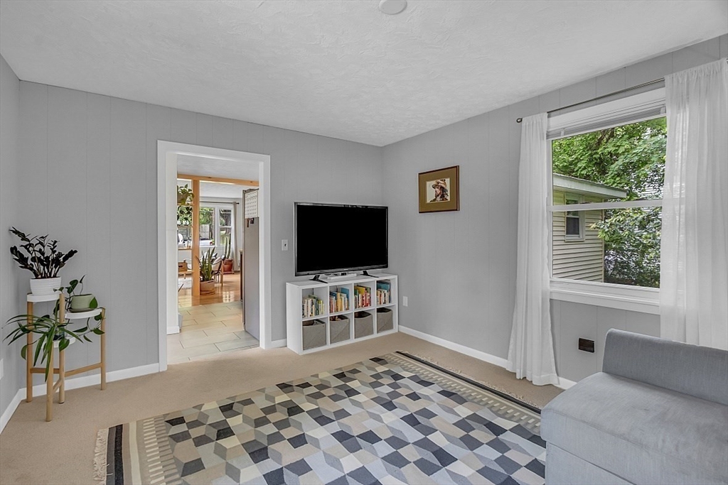 33 Wendover Road Worcester, MA 01606 - Photo 23 of 42 a living room with furniture and a flat screen tv
