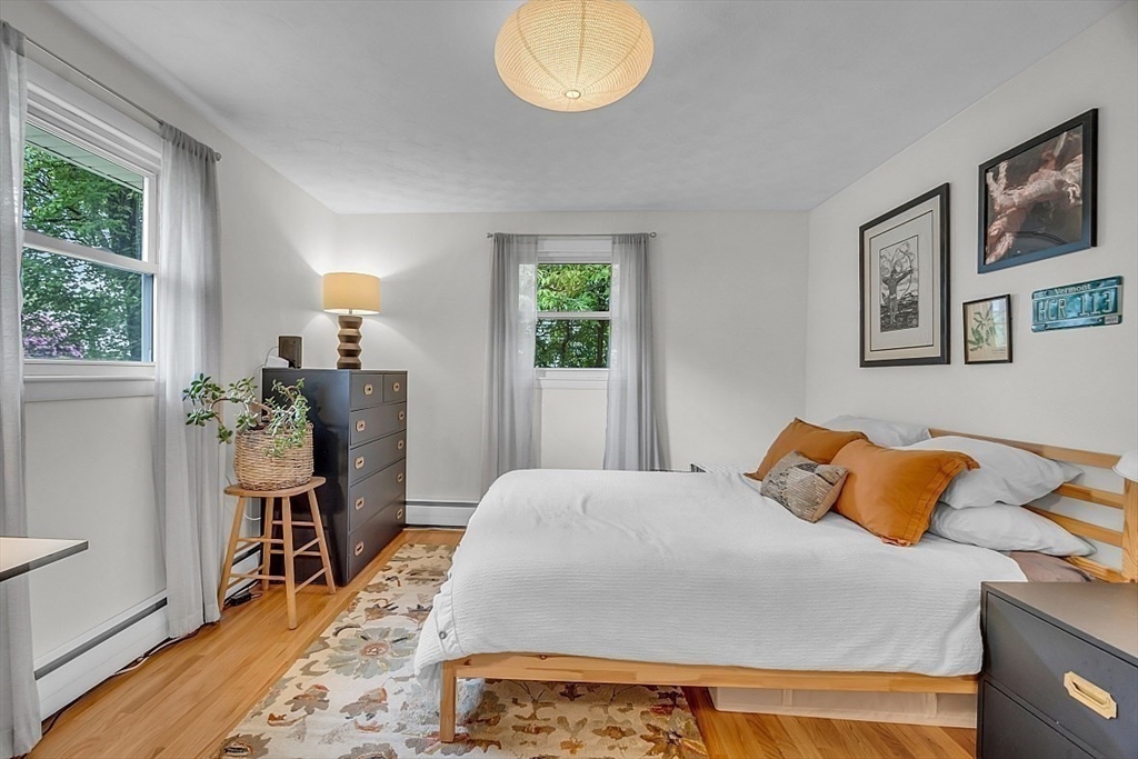 33 Wendover Road Worcester, MA 01606 - Photo 32 of 42 a bedroom with a bed and wooden floor