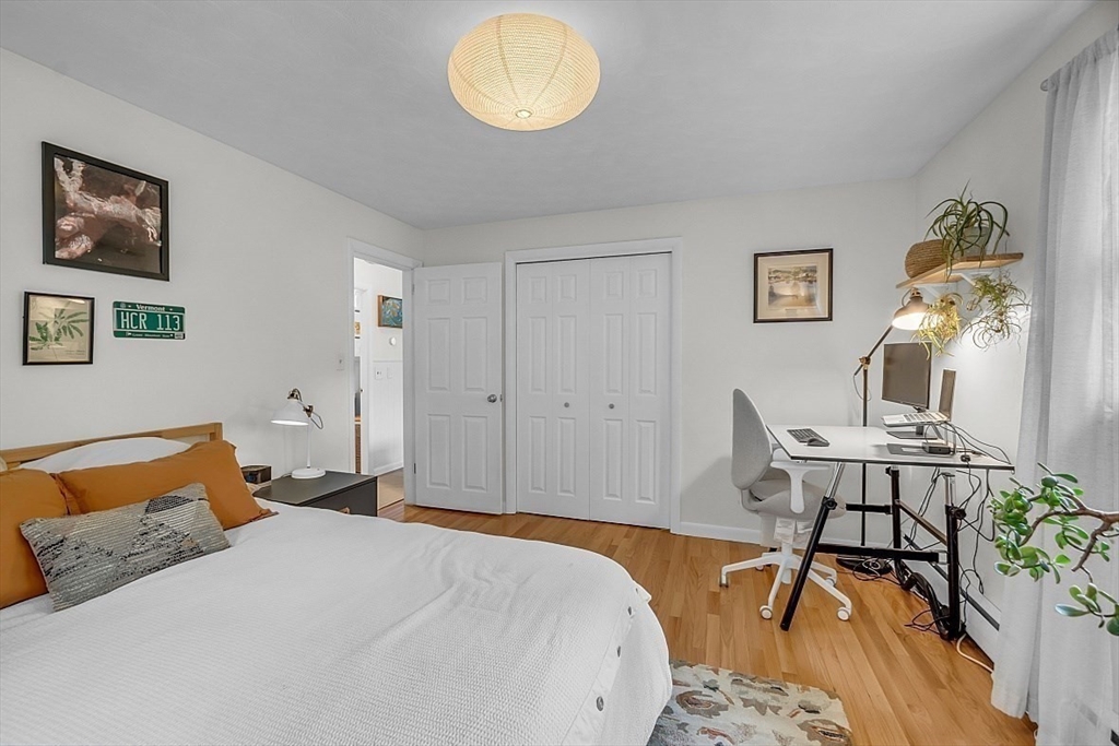 33 Wendover Road Worcester, MA 01606 - Photo 33 of 42 a bedroom with a bed and wooden floor