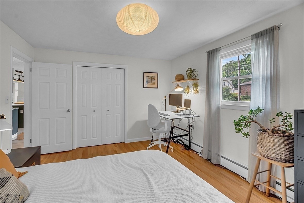 33 Wendover Road Worcester, MA 01606 - Photo 34 of 42 a bedroom with a bed and a potted plant