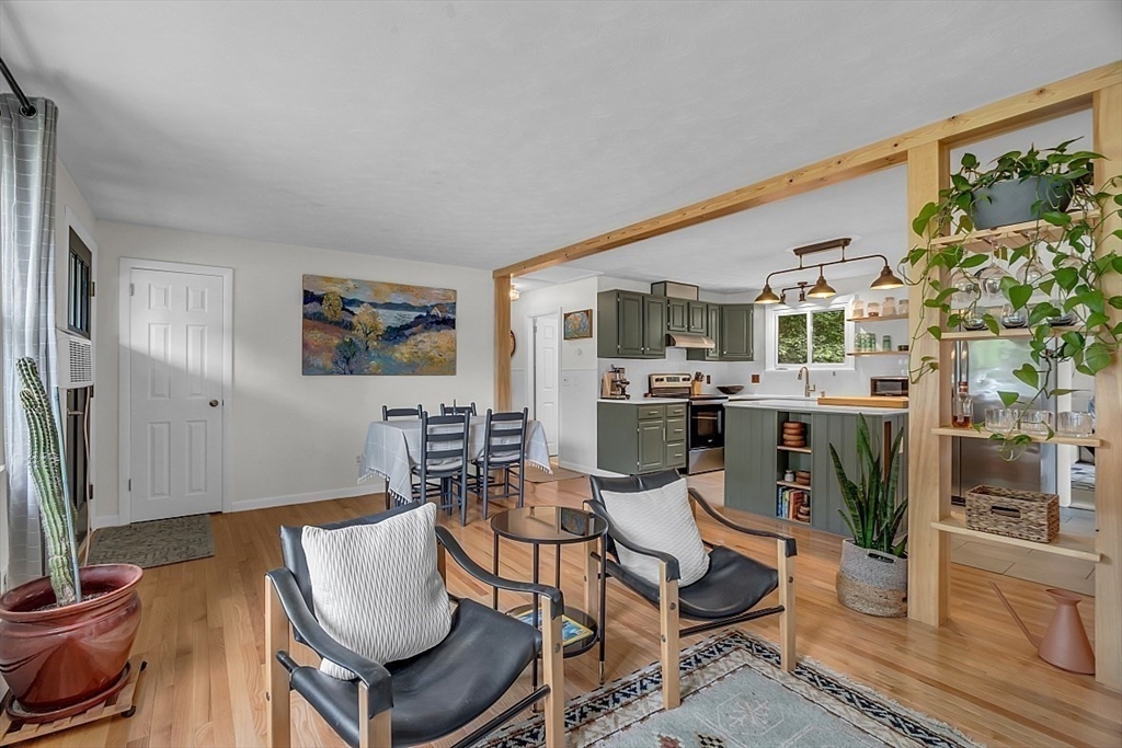 33 Wendover Road Worcester, MA 01606 - Photo 9 of 42 a living room with furniture a flat screen tv and kitchen view