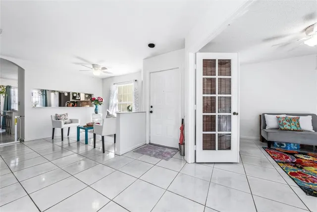 a view of a livingroom with furniture and an empty room