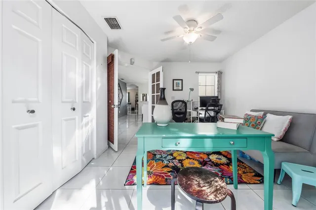 a bed room with furniture and a chair