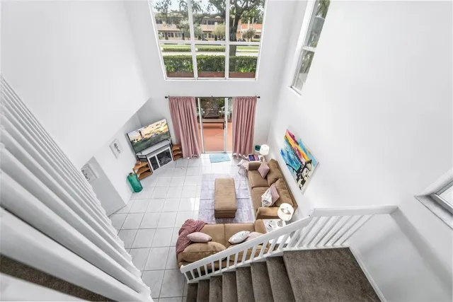 a view of living room with furniture and a window