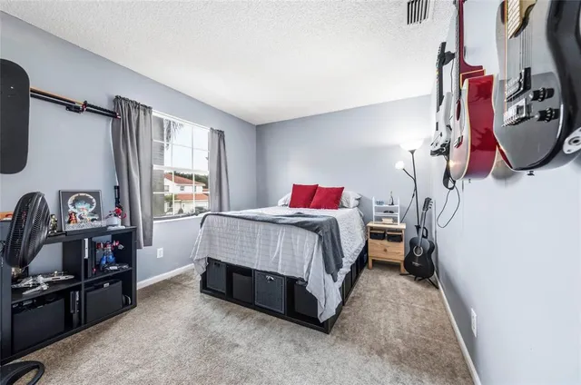 a bed room with a bed and a tv