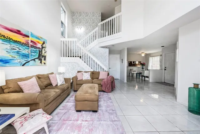 a living room with furniture and a rug