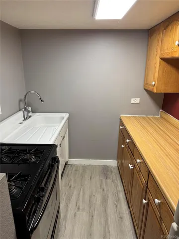 a kitchen with a stove and a sink