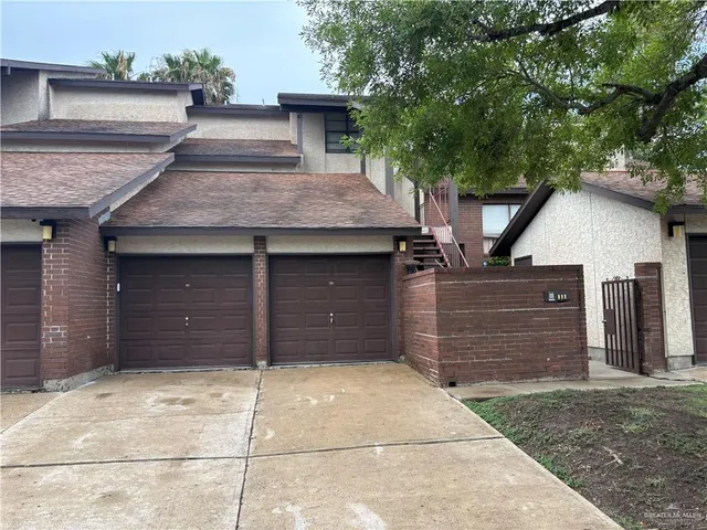 a front view of a house with a garage