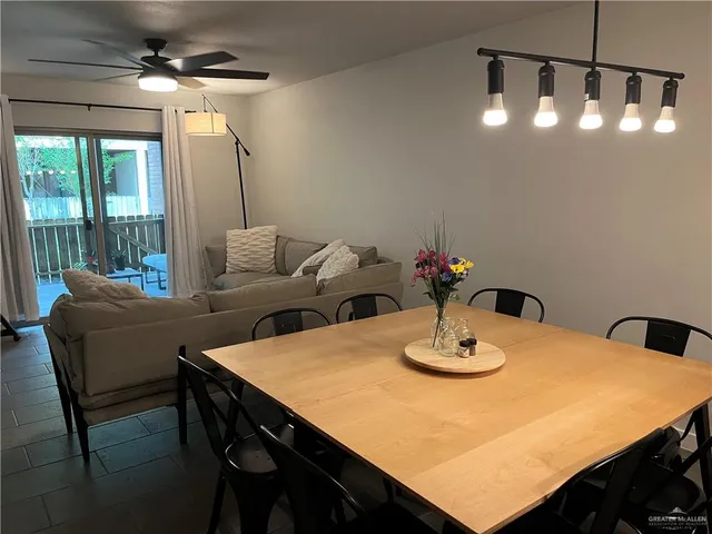 a dining room with furniture and window