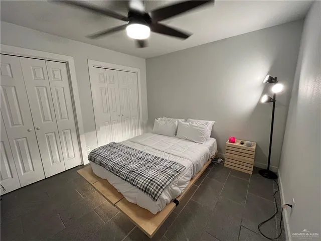 a bedroom with bed and window