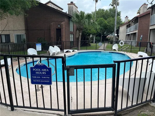 a view of a chairs and a table in the patio