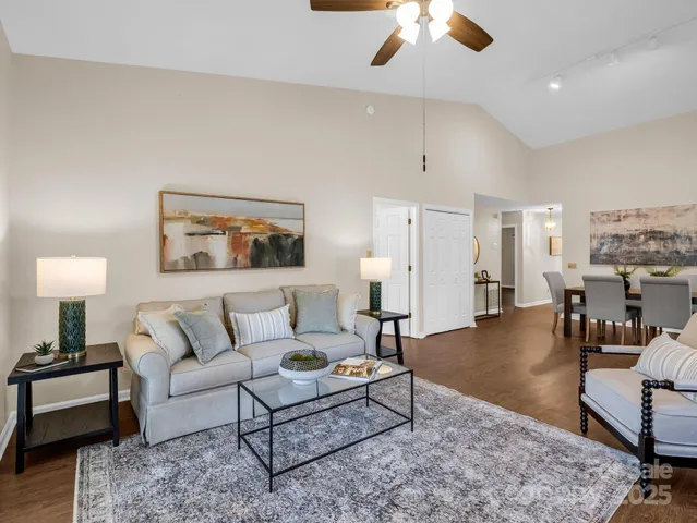 a living room with furniture and a table