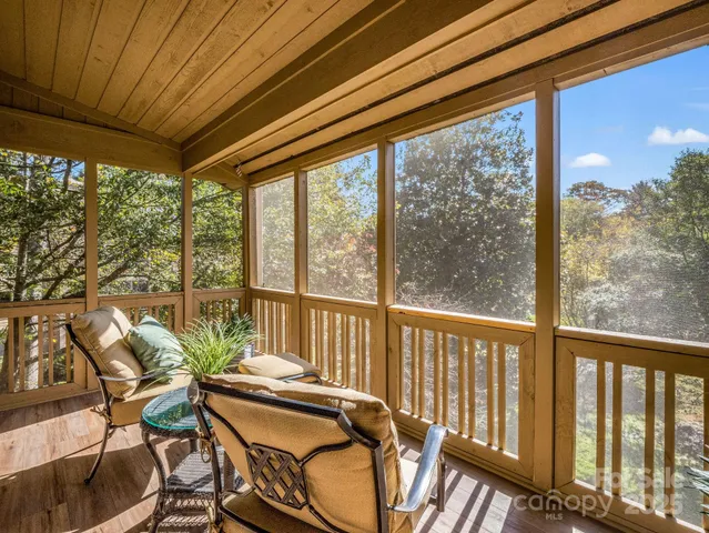a view of a balcony with furniture