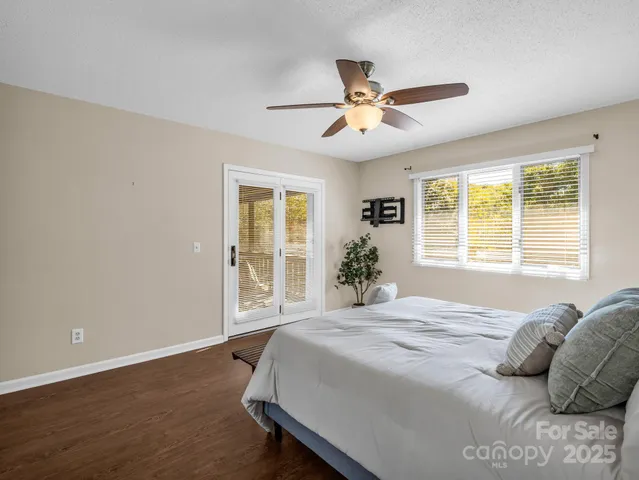 a spacious bedroom with a large bed and a window