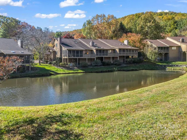 a front view of a house with a lake view
